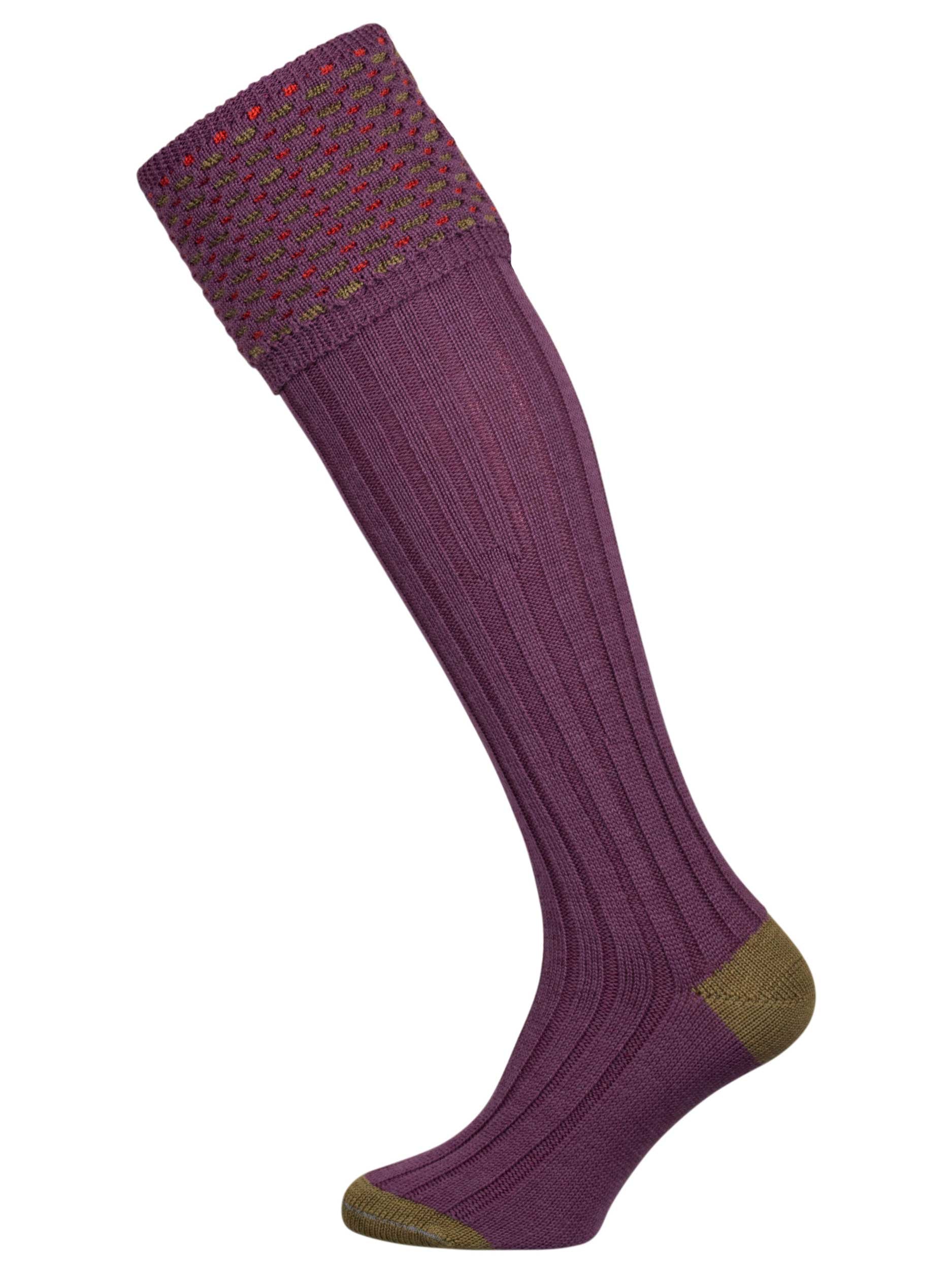 Merino wool shooting sock in mid purple with a green and salmon pattern knitted in the turnover