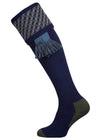 A contemporary technical shooting sock with supportive foot arch in navy blue with ancient blue and mulberry pattern in the turnover
