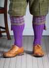 Traditional knitted shooting socks with ribbed leg in bright purple with a fern green chequer board pattern in the turnover