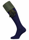 Navy blue shooting sock with a moss green turnover, knitted from 90% premium cotton, with optional green garter tie.