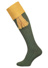 A green knee length cotton sock with gold turnover top for shooting