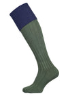 A green knee length cotton sock with navy turnover top for shooting