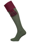 A green knee length cotton sock with burgundy turnover top for shooting