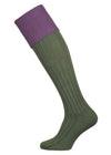 A green knee length cotton sock with purple turnover top for shooting