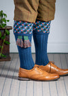 Long knitted shooting socks in mid blue with a ribbed leg, features 4 different colours in the argyle pattern turnover top.