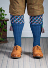 Long knitted shooting socks in mid blue with a ribbed leg, features 4 different colours in the argyle pattern turnover top.
