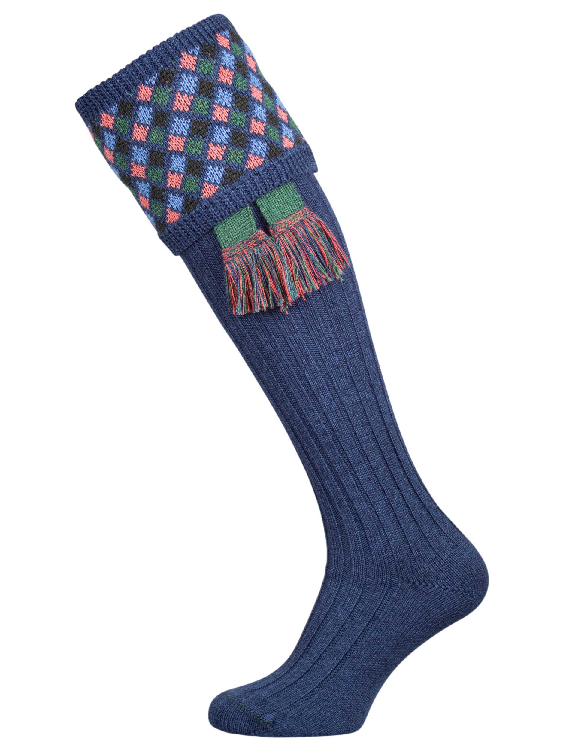 Long knitted shooting socks in mid blue with a ribbed leg, features 4 different colours in the argyle pattern turnover top.