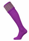Bright purple shooting sock with dark green and purple pattern.
