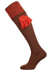 Merino wool shooting sock with brown ribbed leg and an orange pattern knitted in the turnover
