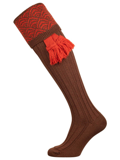 Merino wool shooting sock with brown ribbed leg and an orange pattern knitted in the turnover