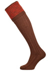 Merino wool shooting sock with brown ribbed leg and an orange pattern knitted in the turnover