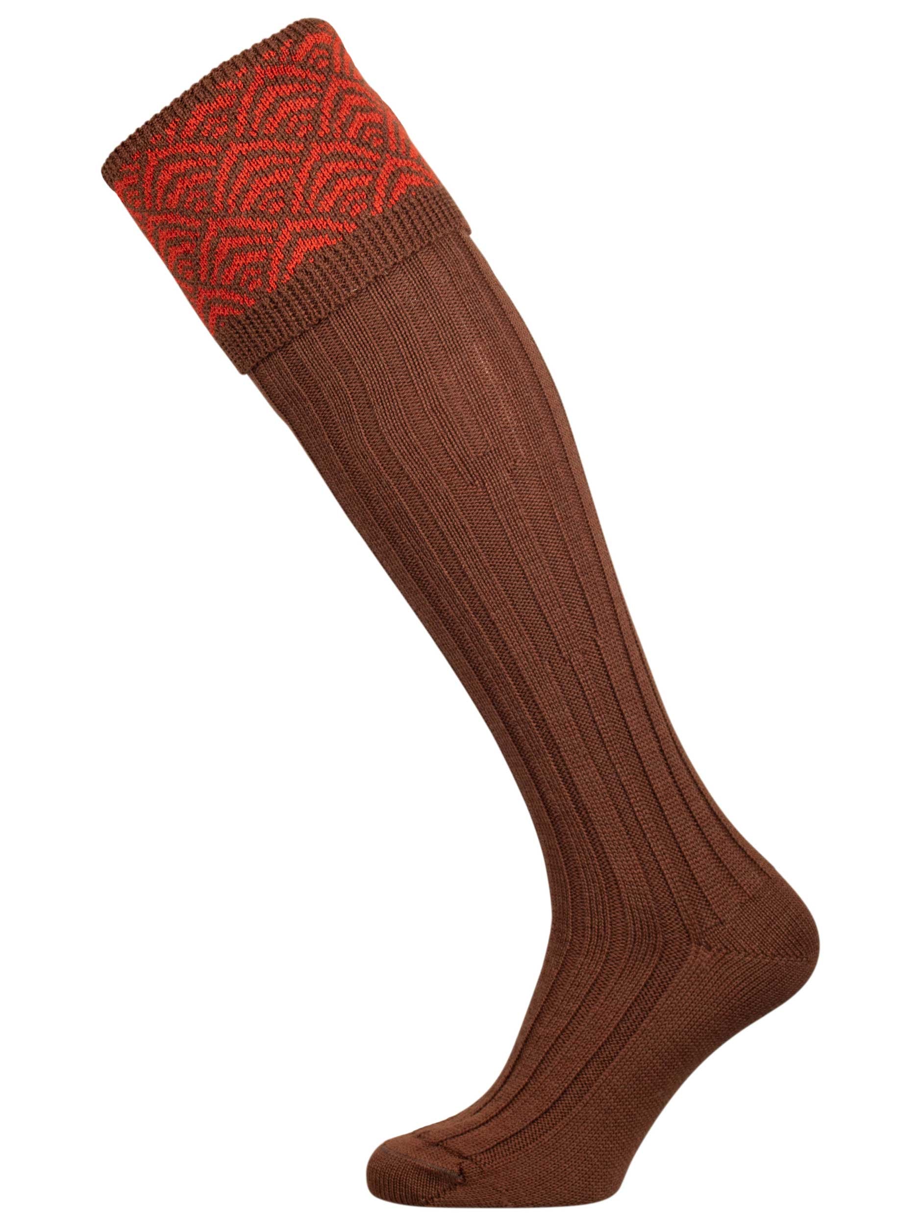 Merino wool shooting sock with brown ribbed leg and an orange pattern knitted in the turnover