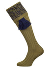 Merino wool shooting sock with a sage green ribbed leg and a navy blue pattern knitted in the turnover