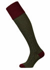 Dark green shooting sock with cable knit detail in the leg and deep burgundy turnover.