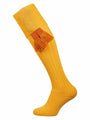 Yellow knee-high sock with orange tassels on a white background