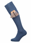 Full length knitted merino wool socks in pale blue with optional beige garter ties