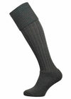 Knee high knitted socks in dark green.