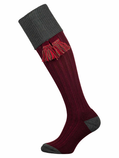 Full length knitted sock in burgundy with a green turnover top and optional garter
