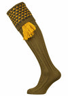 An olive green shooting sock with hunter green and gold detail, optional gold garter tie.