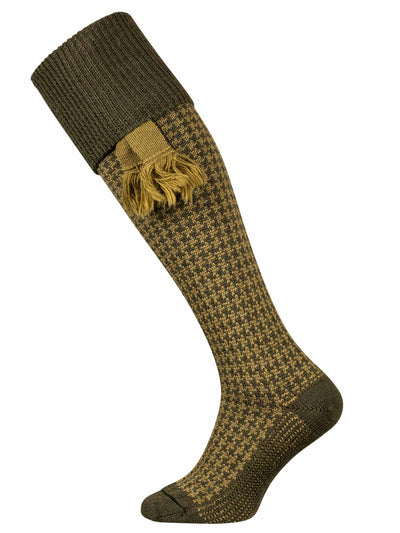 A olive green shooting sock with houndstooth pattern in the leg with an optional sage green garter.