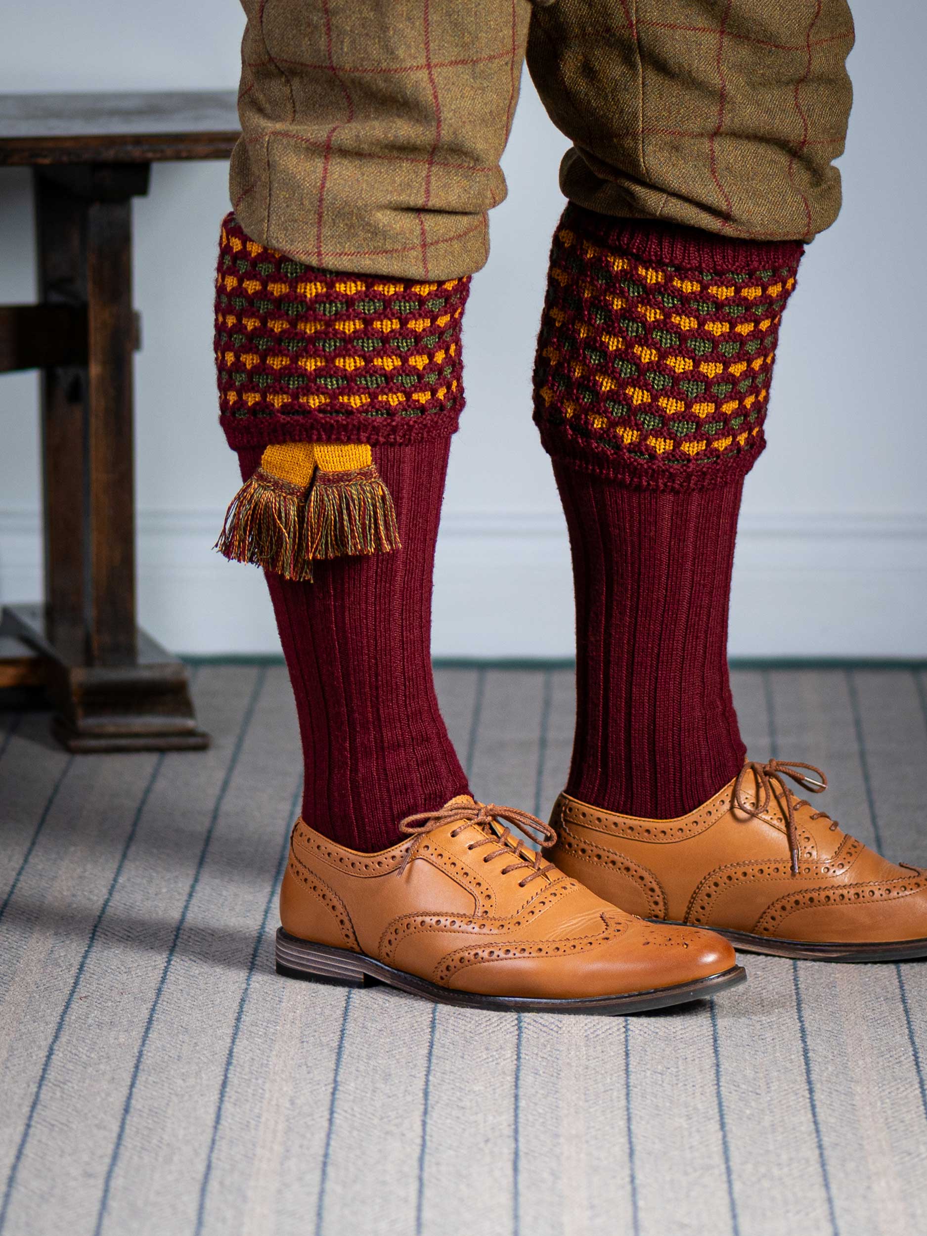 Long knitted shooting socks in burgundy with a ribbed leg, features 2 different colours in the textured knit top