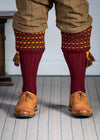Long knitted shooting socks in burgundy with a ribbed leg, features 2 different colours in the textured knit top