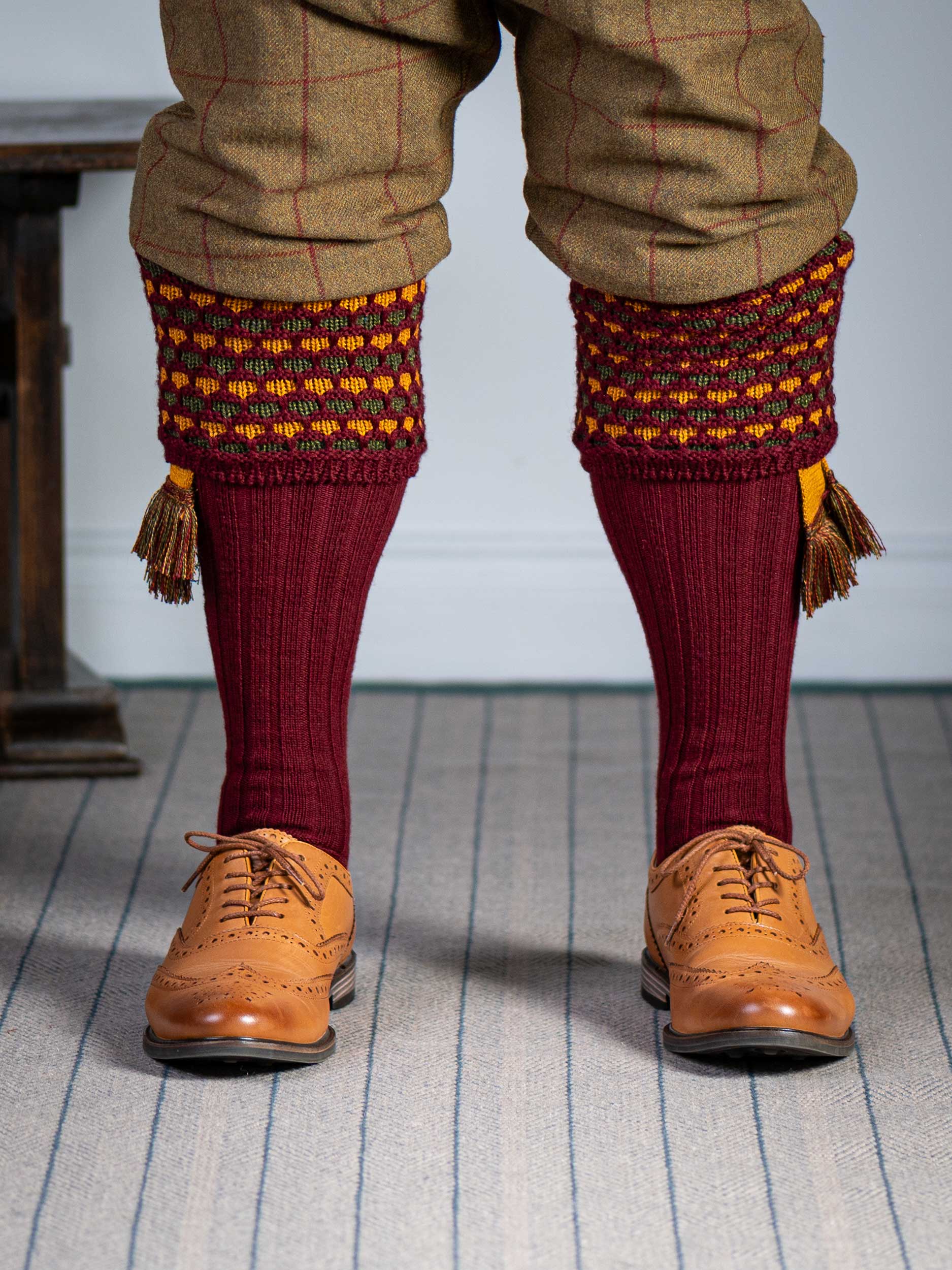 Long knitted shooting socks in burgundy with a ribbed leg, features 2 different colours in the textured knit top