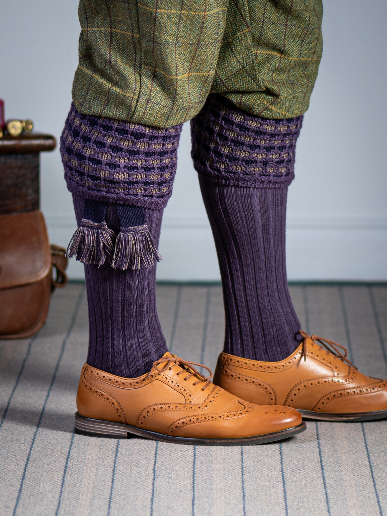 Long knitted shooting socks in purple with a ribbed leg, features 2 different colours in the textured knit top