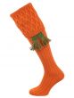 The Rannoch Lattice Knit Shooting Sock in Burnt Orange with optional Ivy Green garter